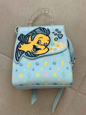 Flounder Danielle Nicole Backpack in Light Blue with Yellow Accent